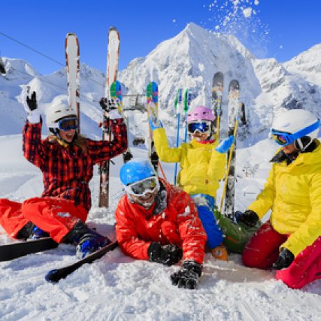 Ski and fun – family enjoying winter holiday Skiing, winter, snow, skiers, sun and fun - family enjoying winter vacations